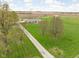 Sprawling single story brick home on expansive green lawn in a rural setting at 10239 Wilson Rd, Brownsburg, IN 46112