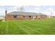 Close up of brick ranch home with large front yard at 10239 Wilson Rd, Brownsburg, IN 46112