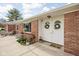 Inviting front porch featuring double doors and garden at 10239 Wilson Rd, Brownsburg, IN 46112