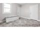 Mud room featuring storage bench, gray tile floor and natural light from window at 10239 Wilson Rd, Brownsburg, IN 46112