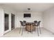 Covered patio features a table and chairs with TV mounted on the wall, and a view of the backyard at 10239 Wilson Rd, Brownsburg, IN 46112