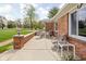 Relaxing patio area with seating and mature landscaping at 10239 Wilson Rd, Brownsburg, IN 46112