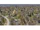 A nice view of a neighborhood, trees and homes from high above in this great aerial shot at 10586 W School Pkwy, Carmel, IN 46280