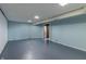 Basement with a painted floor, beadboard paneling, and recessed lighting at 10586 W School Pkwy, Carmel, IN 46280