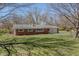 Charming brick ranch home featuring a well-maintained lawn, attached garage and inviting curb appeal at 10586 W School Pkwy, Carmel, IN 46280
