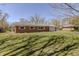 Charming brick home features a large, well-manicured lawn at 10586 W School Pkwy, Carmel, IN 46280