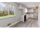 Bright kitchen features lots of natural light and modern vinyl floors at 10586 W School Pkwy, Carmel, IN 46280