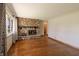 Spacious living room with beautiful hardwood floors and a stone fireplace at 10586 W School Pkwy, Carmel, IN 46280