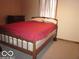 Cozy bedroom with a plush bed and soft lighting at 1080 W Wildflower Ct, Mooresville, IN 46158