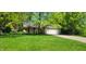 Charming single-story brick home featuring a well-manicured front lawn and an attached two-car garage at 1080 W Wildflower Ct, Mooresville, IN 46158