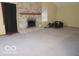 Spacious living room featuring a brick fireplace and abundant natural light at 1080 W Wildflower Ct, Mooresville, IN 46158