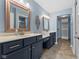 Bathroom features dual vanities, framed mirrors, and a separate walk-in closet at 1098 Extraordinary Trl, Greenfield, IN 46140