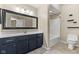 Spacious bathroom with a single vanity, neutral countertops, and a shower and tub combo at 1098 Extraordinary Trl, Greenfield, IN 46140