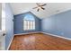 Spacious primary bedroom with vaulted ceiling, ceiling fan, and hardwood floors at 1098 Extraordinary Trl, Greenfield, IN 46140