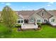 Aerial view of a home with stone and siding, complemented by a manicured lawn and stylish fence at 1098 Extraordinary Trl, Greenfield, IN 46140