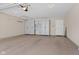 Spacious garage with epoxy flooring, storage cabinets and workspace at 1098 Extraordinary Trl, Greenfield, IN 46140