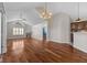 Bright living room features hardwood floors, a fireplace, and high ceilings with views to kitchen at 1098 Extraordinary Trl, Greenfield, IN 46140