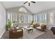 Bright staged sunroom with lots of windows and vaulted ceiling at 1098 Extraordinary Trl, Greenfield, IN 46140