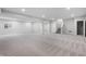 Spacious finished basement with carpet, recessed lighting, and a large window at 11338 Briargate Dr, Fishers, IN 46055