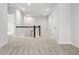 Carpeted upstairs landing with white railing and dark wood trim at 11338 Briargate Dr, Fishers, IN 46055