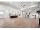Open floor plan includes kitchen with island and view of the living room and staircase at 11338 Briargate Dr, Fishers, IN 46055