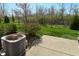 Spacious backyard features mature trees and a concrete patio at 1175 Bent Tree Way, Plainfield, IN 46168