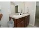Well-lit bathroom with a double sink vanity, storage, and large mirror at 1175 Bent Tree Way, Plainfield, IN 46168
