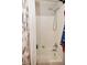 Bright bathroom showcasing a shower-tub combo, neutral walls, and a decorative shower curtain at 1175 Bent Tree Way, Plainfield, IN 46168