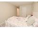 Cozy bedroom featuring neutral walls, plush carpet, and a comfortable bed with a playful, colorful patterned quilt at 1175 Bent Tree Way, Plainfield, IN 46168