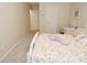 Cozy bedroom featuring neutral walls, plush carpet, and a comfortable bed with a playful, colorful patterned quilt at 1175 Bent Tree Way, Plainfield, IN 46168