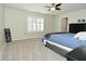 Bedroom with neutral walls, carpeted flooring, ceiling fan, and modern plantation shutters at 1175 Bent Tree Way, Plainfield, IN 46168