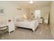 A charming bedroom features neutral walls, plush carpet, and a desk with a chair at 1175 Bent Tree Way, Plainfield, IN 46168
