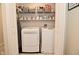 Practical laundry room with modern washer and dryer and ample storage space at 1175 Bent Tree Way, Plainfield, IN 46168