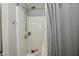 Clean shower with showerhead and gray curtain, ready for relaxation at 1175 Bent Tree Way, Plainfield, IN 46168