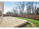 Backyard featuring a concrete patio, grass, and wood fence at 122 Winding Brook Way, Pendleton, IN 46064