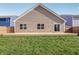A level backyard featuring a concrete patio is accessible from the rear of the home at 122 Winding Brook Way, Pendleton, IN 46064