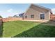 The backyard boasts a concrete patio and a well maintained lawn at 122 Winding Brook Way, Pendleton, IN 46064