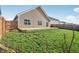 The lush backyard is accessible from the back door via a concrete patio and boasts ample lawn at 122 Winding Brook Way, Pendleton, IN 46064