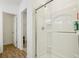 Bright bathroom featuring a glass-enclosed shower with white tile and modern fixtures at 122 Winding Brook Way, Pendleton, IN 46064