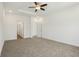 Bedroom featuring plush carpets, neutral walls, bright windows, and a ceiling fan at 122 Winding Brook Way, Pendleton, IN 46064