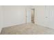 Bright bedroom featuring carpeted floor, neutral walls and access to the hall at 122 Winding Brook Way, Pendleton, IN 46064