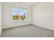 Bright bedroom with a large window overlooking the yard and carpeted flooring at 122 Winding Brook Way, Pendleton, IN 46064