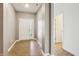 Inviting foyer with light wood floors, a double front door, and neutral paint at 122 Winding Brook Way, Pendleton, IN 46064