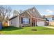 Beautiful exterior view of single Gathering home with landscaped yard and brick accents at 122 Winding Brook Way, Pendleton, IN 46064