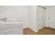 Bright laundry room with front load washer and sliding closet doors at 122 Winding Brook Way, Pendleton, IN 46064