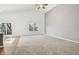 Bright living room featuring vaulted ceilings, large windows, and neutral carpet at 122 Winding Brook Way, Pendleton, IN 46064