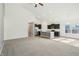 Open concept living space flowing into a modern kitchen with stainless steel appliances and a center island at 122 Winding Brook Way, Pendleton, IN 46064
