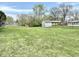 Spacious backyard with a chain link fence and a shed; perfect for outdoor activities at 1221 S Catherwood Ave, Indianapolis, IN 46203