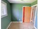 Bedroom with neutral flooring and a door to the hallway at 1221 S Catherwood Ave, Indianapolis, IN 46203
