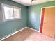 Cozy bedroom with window and closet at 1221 S Catherwood Ave, Indianapolis, IN 46203